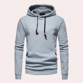 Men's light gray quilted hoodie with a textured finish, featuring a jersey fabric, long sleeves, and a comfortable neck collar, in size 2XL.