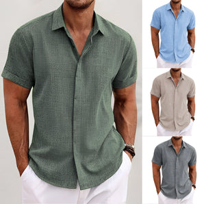 Men's white linen short sleeve button-up shirt, showcasing a breathable and lightweight fabric with a casual fit, highlighting the shoulder and neck areas.