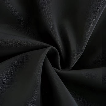 Men's luxury black leather jacket with red piping displayed against a dark, monochrome background, showcasing a stylish and modern designer biker look with a focus on the jacket's texture and symmetry.