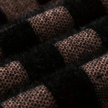 Men's luxury black plaid crew neck sweater made from wool with a geometric pattern.