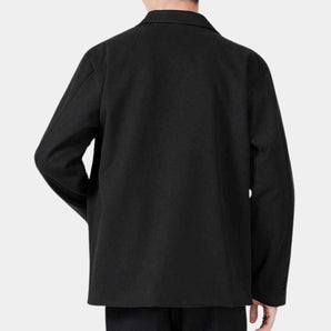 Men's luxury black wool blazer featuring a modern fit with tailored design, showcasing long sleeves, a structured collar, and a sleek, sophisticated appearance.