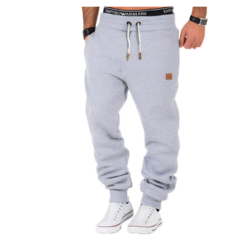 Men's luxury light gray joggers in size 3XL with an athletic design, featuring a cuffed hem and tailored fit for comfort and style, suitable for casual and sportswear occasions.
