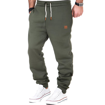 Men's luxury grey joggers in a designer athletic style, featuring a cuffed design at the ankles, shown in a green color variant and size 3XL.