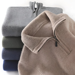 Men's luxury half-zip cashmere sweater in a soft grey color, featuring a high collar and long sleeves, made from premium knitwear fabric.