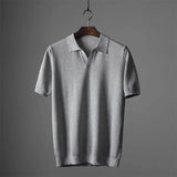Men's luxury gray knit polo shirt in size 3XL, featuring a classic collar, button-up front, and short sleeves, designed for style and breathability.