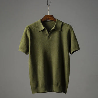 Men's luxury knit polo shirt in green, featuring a sleek design with a stylish collar and button-down front, displayed on a clothes hanger.