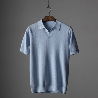 Men's luxury knit polo shirt in light blue, size 3XL, featuring a stylish design with a classic collar, short sleeves, and breathable fabric ideal for casual or semi-formal wear.