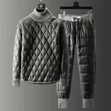 Men's black luxury quilted insulated tracksuit with a focus on the shoulder and sleeve design, featuring a collar and a hint of tartan pattern, designed for winter athleisure wear.