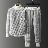 Men's luxury quilted insulated tracksuit in gray, size 4XL, featuring a high collar, long sleeves, and a stylish winter athleisure design. Displayed on a clothes hanger, highlighting the garment's outerwear qualities and rectangular quilted pattern.