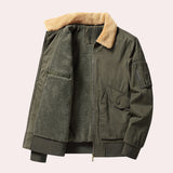Men's olive green shearling bomber jacket in size 2XL, featuring a warm, luxurious design with a prominent collar, button closure, and pockets, styled for winter outerwear.