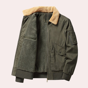 Men's olive green shearling bomber jacket in size 2XL, featuring a warm, luxurious design with a prominent collar, button closure, and pockets, styled for winter outerwear.