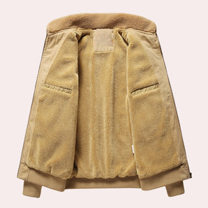 Men's luxury tan shearling bomber jacket featuring a warm, beige khaki color, with a collar and full sleeves.