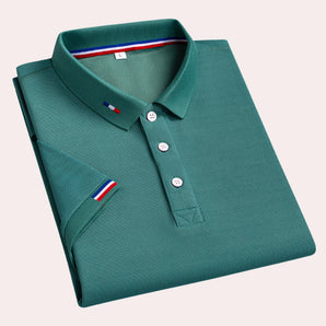 Men's luxury teal polo shirt featuring a designer stripe trim, shown in a green color and size 2XL. The shirt has a classic collar, button closure, and short sleeves, showcasing a modern pattern and elegant design.