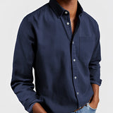 Men's dark blue canvas shirt designed for outdoor workwear, featuring a rugged and durable material with long sleeves and a collared neckline in a 5XL size.