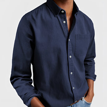 Men's dark blue canvas shirt designed for outdoor workwear, featuring a rugged and durable material with long sleeves and a collared neckline in a 5XL size.