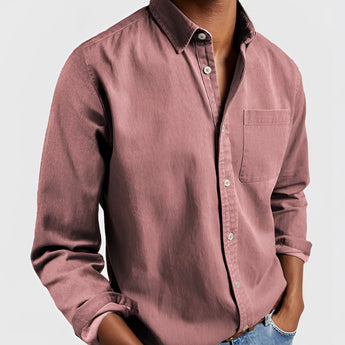 Men's military green canvas shirt displayed with a focus on its durable construction, featuring a classic collar and button-up design; suitable for outdoor work environments.