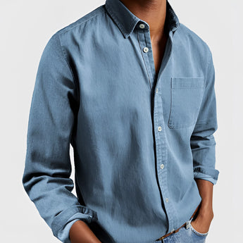 Men's military green canvas shirt featuring a classic collar and long sleeves, designed for durable outdoor workwear.