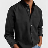 Men's military green canvas shirt, shown in Nero color, featuring a durable design suitable for outdoor workwear. The shirt, available in size 5XL, includes long sleeves and a classic collar, crafted from sturdy textile material.