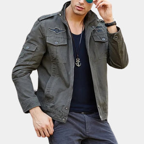 Men's grey military-style cargo jacket with multiple pockets, lightweight design, and long sleeves.