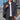 Men's blue bomber jacket in 2XL size, featuring a minimalist design with a clean silhouette. The jacket has a sleek finish and versatile style, suitable for casual wear. The model is standing, showcasing the jacket's well-fitted shoulders and sleeves.