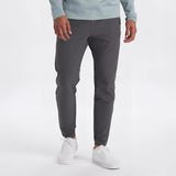 Light grey men's moisture-wicking quick-dry athletic t-shirt, size 2XL, worn by a person, showing sleeves and part of the torso.
