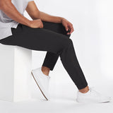 Men's light grey moisture-wicking quick-dry athletic t-shirt shown on a male model, highlighting short sleeves and sporty fit.