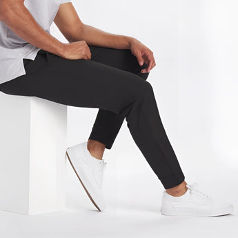 Men's light grey moisture-wicking quick-dry athletic t-shirt shown on a male model, highlighting short sleeves and sporty fit.