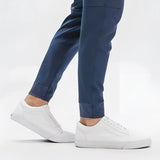 Light grey men's moisture-wicking quick-dry athletic t-shirt worn by a model with active pants.