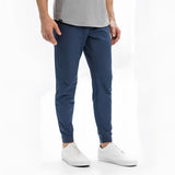 Light grey men's athletic t-shirt with moisture-wicking and quick-dry properties, shown worn by a model for a full-body view.