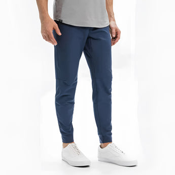 Light grey men's athletic t-shirt with moisture-wicking and quick-dry properties, shown worn by a model for a full-body view.
