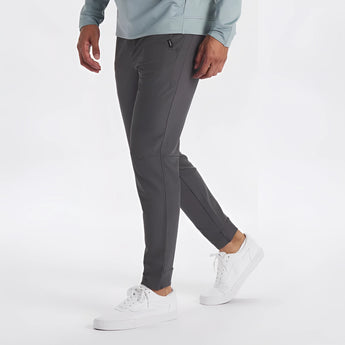Light grey men's moisture-wicking quick-dry athletic t-shirt worn with jeans.