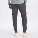 Men's light grey moisture-wicking quick-dry athletic t-shirt worn by a model standing upright.