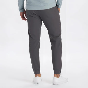 Men's light grey moisture-wicking quick-dry athletic t-shirt worn by a model standing upright.
