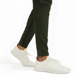 Light grey men's moisture-wicking quick-dry athletic t-shirt worn by a person, paired with active pants.