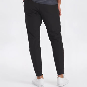 Men's light grey moisture-wicking quick-dry athletic t-shirt with short sleeves, worn with active pants, model posing outdoors.