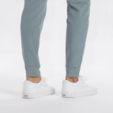 Men's light grey moisture-wicking quick-dry athletic t-shirt being worn, showing full sleeves and activewear style.