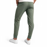 Men's light grey moisture-wicking quick-dry athletic t-shirt worn by a person, paired with active pants.