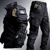 Men's MultiCam Tactical Combat Uniform in Nero color, size 3XL, featuring military-grade camouflage pattern with long sleeves, cargo pants, and a glove visible, suitable for outdoor work or sports activities.