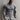 Men's muscle-fit grey Henley shirt in size XL, featuring a slim-fit design with long sleeves and a thermal texture, modeled by a person showcasing the shirt's neckline and sleeve details.