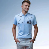 Men's Nautical Teal Embroidered Polo Shirt worn by a man standing, featuring short sleeves and light blue color, suitable for stylish summer wear.