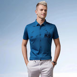 Men's Nautical Teal Embroidered Polo Shirt in Ocean Blue, displayed on a model standing, highlighting the arm, shoulder, and sleeve details with a focus on the upper body fit.