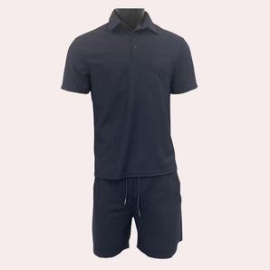 Men's navy blue polo and shorts set featuring a short-sleeve polo shirt with a collar, suitable for casual summer wear.