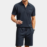 Men's navy blue polo shirt and shorts set in marine blue, featuring a breathable short-sleeve polo with a collar, paired with comfortable Bermuda shorts, suitable for casual summer wear in size 2XL.