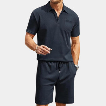Men's navy blue polo shirt and shorts set in marine blue, featuring a breathable short-sleeve polo with a collar, paired with comfortable Bermuda shorts, suitable for casual summer wear in size 2XL.
