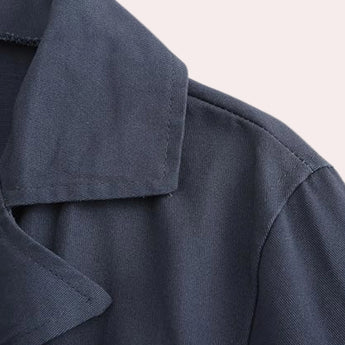 Men's navy blue wool double-breasted peacoat featuring a classic design with a notched collar, button-front closure, and long sleeves, suitable for winter fashion.