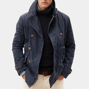 Men's navy blue wool double-breasted peacoat featuring wide lapels, button closure, and long sleeves, styled for winter fashion.
