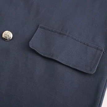Men's navy blue wool double-breasted peacoat with a classic collar and button detailing, showcasing a timeless winter fashion style.