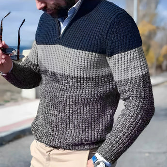 Men's gray chunky knit sweater with a high collar, featuring a textured design and long sleeves.