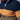 Men's navy and mustard chunky knit high-collar sweater with long sleeves, featuring a textured design.