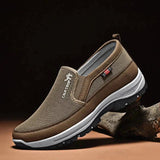 Men's navy slip-on waterproof walking shoes with lightweight and anti-slip features, designed for outdoor activities.